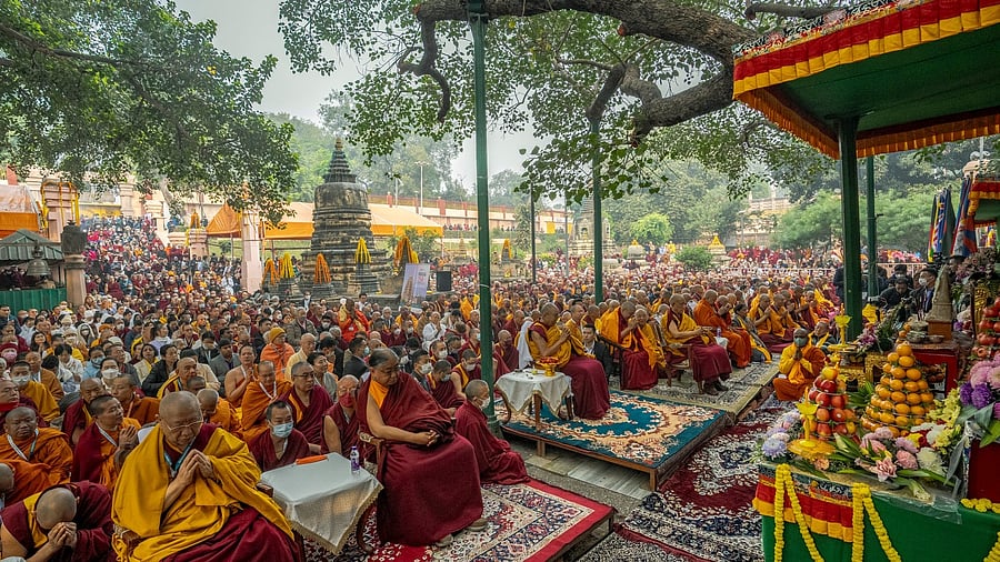 <div class="paragraphs"><p>Monks gather for prayer under the Bodhi tree at the Mahabodhi Temple, site of Buddha's enlightement in Bihar</p></div>