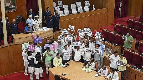 <div class="paragraphs"><p>Congress MLAs stage a protest in Odisha Assembly.</p></div>
