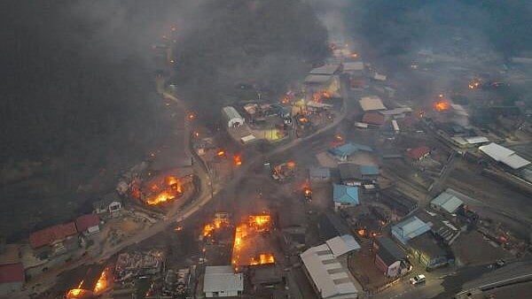 <div class="paragraphs"><p>Smoke rises from a wildfire that devastates the area, in Andong, South Korea.</p></div>