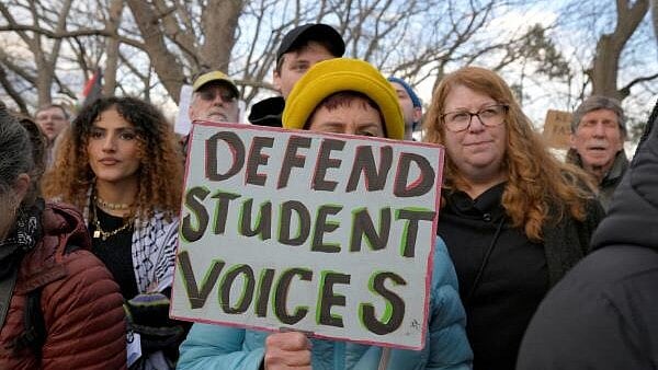 <div class="paragraphs"><p>Demonstrators take part in the Stand with Rumeysa Ozturk,Tufts PHD Student emergency rally, at Powder House Square Park, after Ozturk was taken into custody by federal agents, in Somerville, Massachusetts.</p></div>