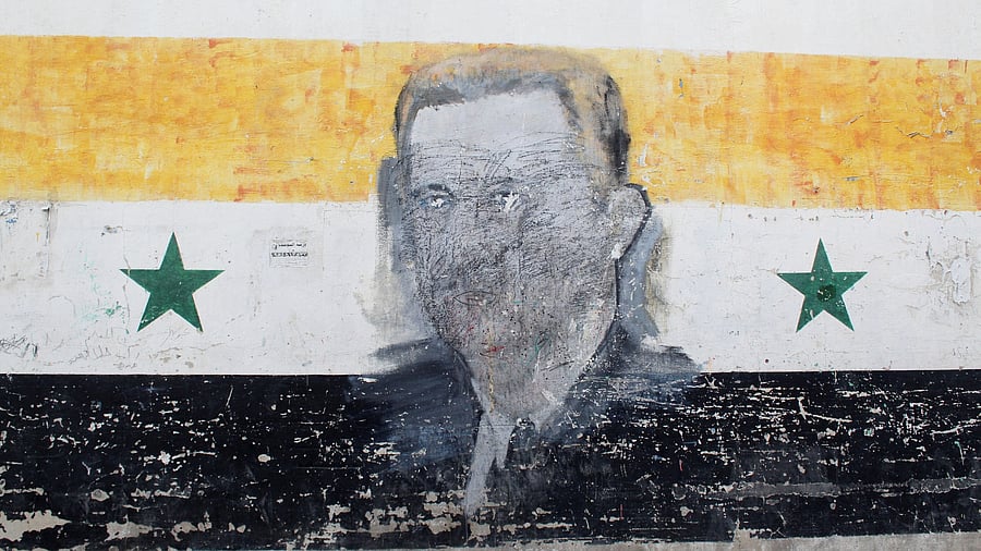<div class="paragraphs"><p>A wall painted with a damaged drawing of ousted Syrian President Bashar al-Assad is pictured in the al-Qadam neighbourhood in Damascus, Syria, March 26, 2025. </p></div>