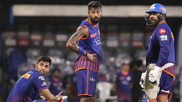 <div class="paragraphs"><p>Mumbai Indians captain Suryakumar Yadav and teammates Rohit Sharma and Hardik Pandya during a training session</p></div>