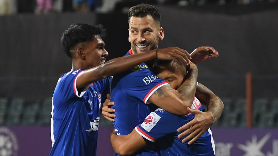 <div class="paragraphs"><p>Bengaluru FC’s Suresh Singh Wangjam (right) is embraced by his team-mates after scoring against Mumbai City FC at the Sree Kanteerava stadium on Saturday. </p></div>