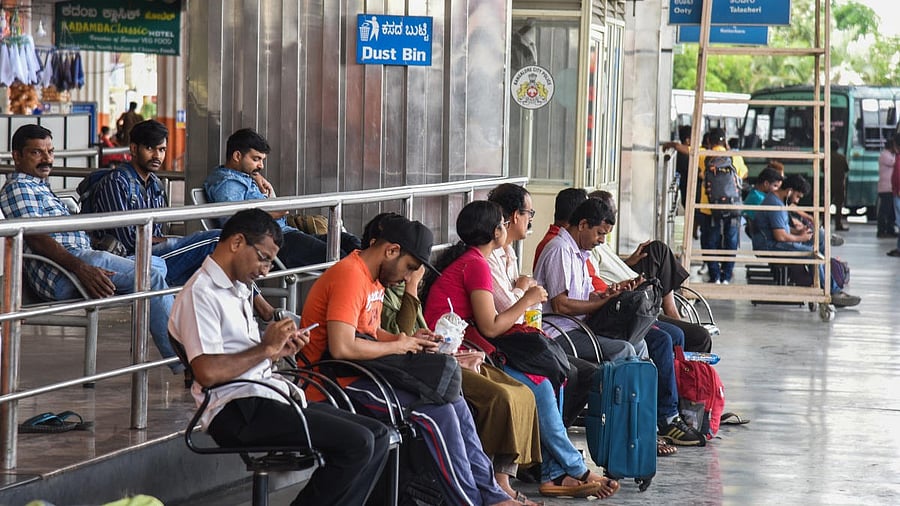 <div class="paragraphs"><p>Passengers wait for buses at Satellite Bus stand, Mysuru Road, in Bengaluru. Image for representation</p></div>