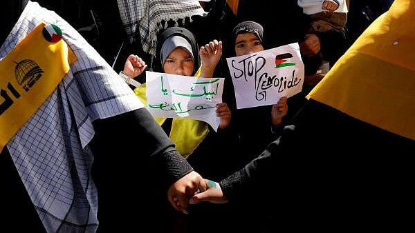 <div class="paragraphs"><p>Shi'ite Muslim girls hold placards during a rally to mark the annual al-Quds Day (Jerusalem Day) in support of the Palestinian people, in Kashmir's Budgam.</p></div>