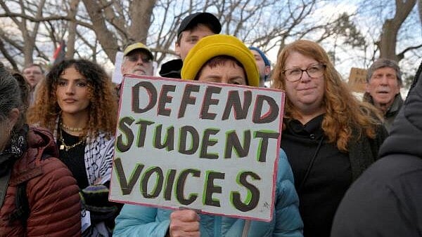 <div class="paragraphs"><p>Demonstrators take part in the Stand with Rumeysa Ozturk,Tufts PHD Student emergency rally, at Powder House Square Park, after Ozturk was taken into custody by federal agents, in Somerville, Massachusetts.</p></div>