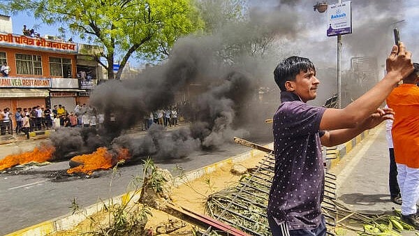 <div class="paragraphs"><p>Tyres set on fire by members of a right-wing group protesting over alleged vandalism at Tejaji temple, in Jaipur, Saturday, March 29, 2025.</p></div>