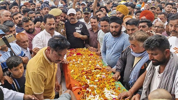 <div class="paragraphs"><p>Family members during the cremation of constable Balwinder Singh Chib, who was killed in a gunfight with terrorists, in Kathua district, Saturday.&nbsp;</p></div>