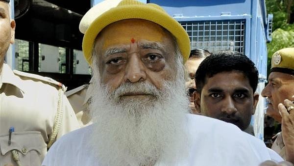 <div class="paragraphs"><p>File photo of Asaram Bapu being produced in Jodhpur court in connection with the sexual harassment case. A Jodhpur court on Wednesday convicted self-styled godman Asaram of raping a minor girl at his ashram in Rajasthan in 2013.</p></div>