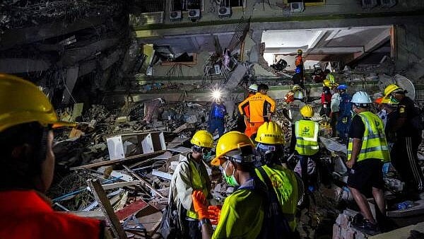 <div class="paragraphs"><p>Rescuers work at the site of a damaged building, in the aftermath of a strong earthquake, in Mandalay, Myanmar.</p></div>