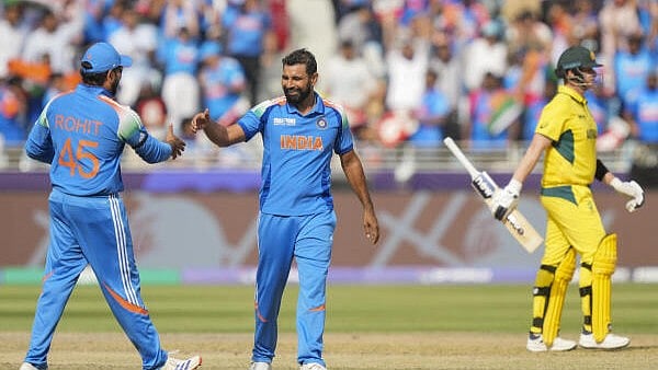 <div class="paragraphs"><p>India's Mohammed Shami celebrates with Rohit Sharma after dismissing Australia's Steve Smith during the ICC Champions Trophy semi-final cricket match between India and Australia, in Dubai, UAE.</p></div>