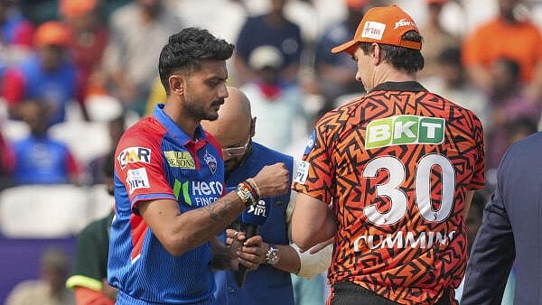 <div class="paragraphs"><p>Delhi Capitals’ captain Axar Patel and Sunrisers Hyderabad’s Pat Cummins during the toss before an Indian Premier League (IPL) 2025</p></div>