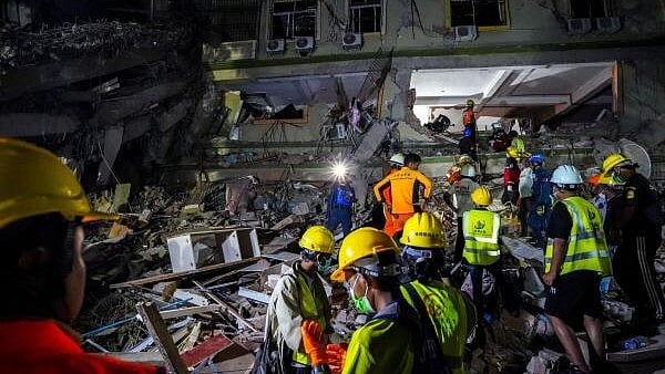 <div class="paragraphs"><p>Rescuers work at the site of a damaged building, in the aftermath of a strong earthquake, in Mandalay, Myanmar.</p></div>