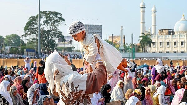<div class="paragraphs"><p>A Muslim devotee with her child during Eid al-Fitr, marking the end of the holy month of Ramzan, in Thiruvananthapuram.&nbsp;</p></div>