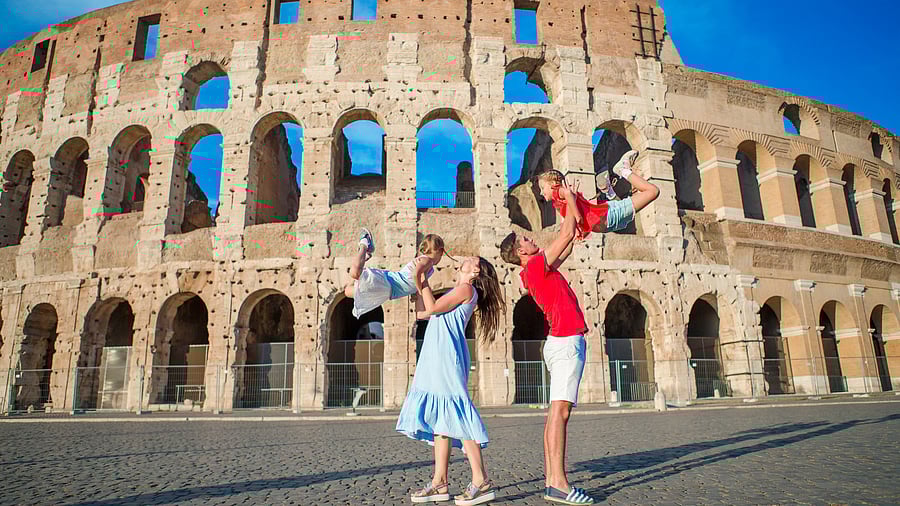 <div class="paragraphs"><p>Couple with children outside the&nbsp;Colosseum in Italy. (Representative image)</p></div>