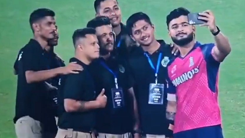 <div class="paragraphs"><p>Screengrab from a video showing Riyan Parag taking a selfie with stadium ground staff after a match against CSK.</p></div>