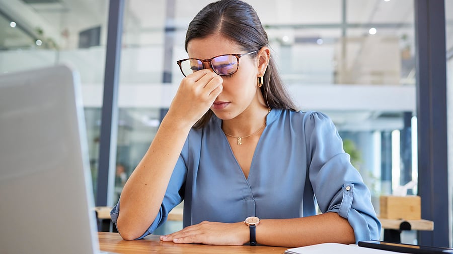 <div class="paragraphs"><p>Stress headache, burnout and woman in office overwhelmed with workload at desk with laptop. Frustrated, overworked and tired woman with computer at startup, anxiety from deadline time pressure crisis.</p></div>