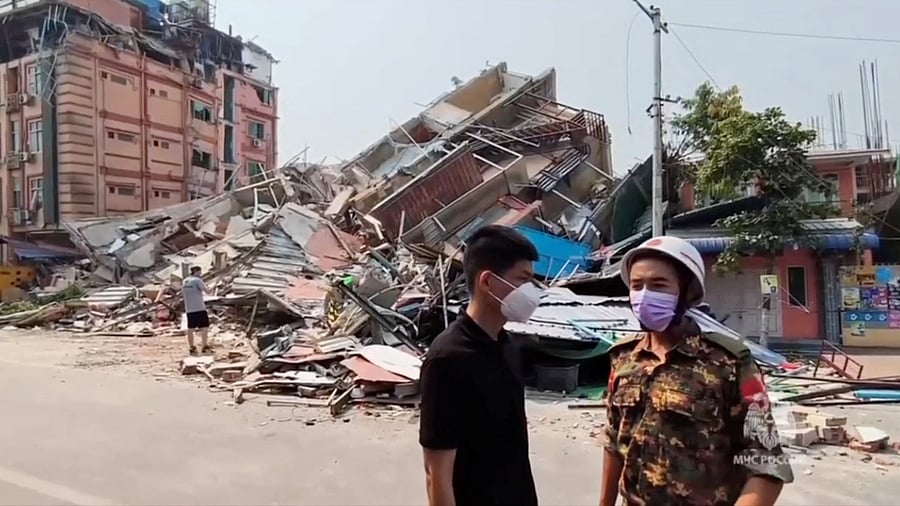 <div class="paragraphs"><p>People gather near the debris of destroyed buildings during a rescue and search operation following a massive earthquake in Mandalay, Myanmar, in this still image from video released April 1, 2025. </p></div>