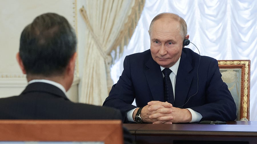 <div class="paragraphs"><p>File Photo: Russia's President Vladimir Putin with China's Foreign Minister Wang Yi. </p></div>