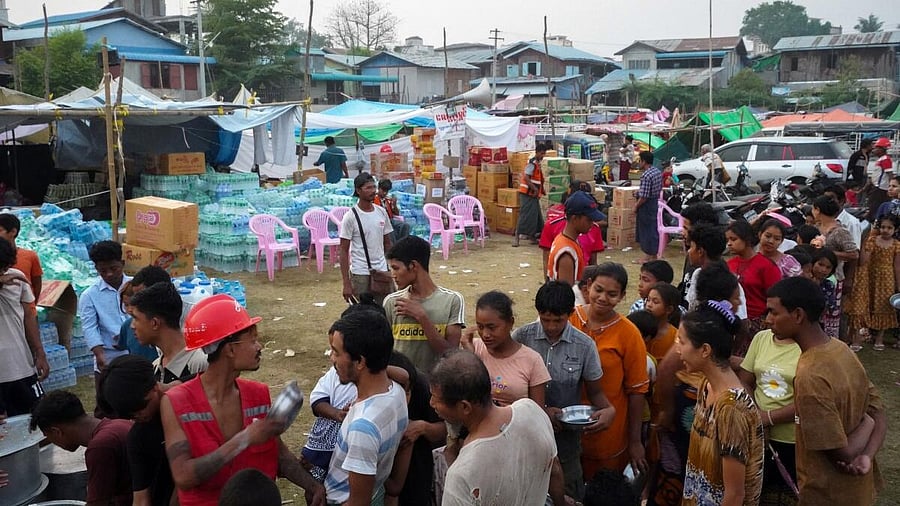 <div class="paragraphs"><p>People queue for food and relief supplies after a strong earthquake in Amarapura, Myanmar.</p></div>