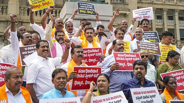 <div class="paragraphs"><p>BJP leaders R Ashok, BY Vijayendra, Chalavadi Narayanswamy and others during a protest over the suspension of BJP MLAs from Assembly, at Vidhan Soudha in Bengaluru, Karnataka</p></div>