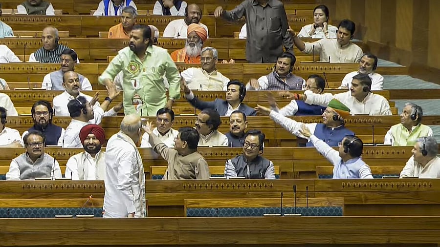 <div class="paragraphs"><p>BJP MP Suresh Gopi reacts after opposition MPs interrupt Union Home Minister Amit Shah's speech in the Lok Sabha during the Budget session of Parliament</p></div>