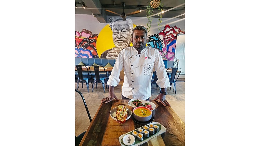 <div class="paragraphs"><p>Chef Babu with some dishes from the special mango menu at Nasi and Mee.</p></div>