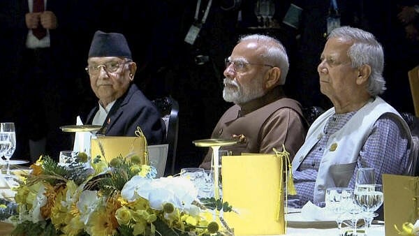 <div class="paragraphs"><p>In this image released by @ChiefAdviserGoB via X on April 3, 2025, Prime Minister Narendra Modi with his Nepali counterpart K.P. Sharma Oli and Chief Adviser of Bangladesh Muhammad Yunus dinner the official dinner at the BIMSTEC Summit, in Bangkok, Thailand.</p></div>