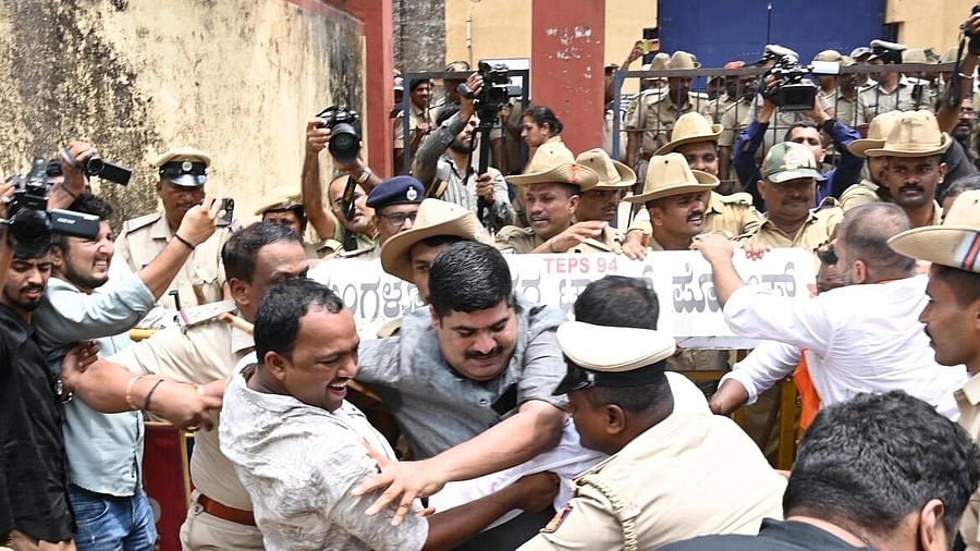 <div class="paragraphs"><p>A large group of BJP workers on Saturday stormed into the district jail here allegedly over placement of mobile jammers following which nearly 100 of them were detained, officials said.</p></div>