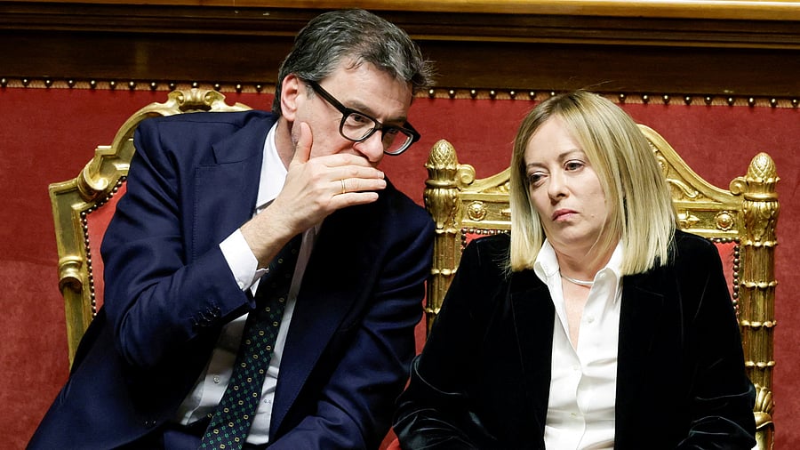 <div class="paragraphs"><p>Italy's Prime Minister Giorgia Meloni talks with Economy Minister Giancarlo Giorgetti</p></div>