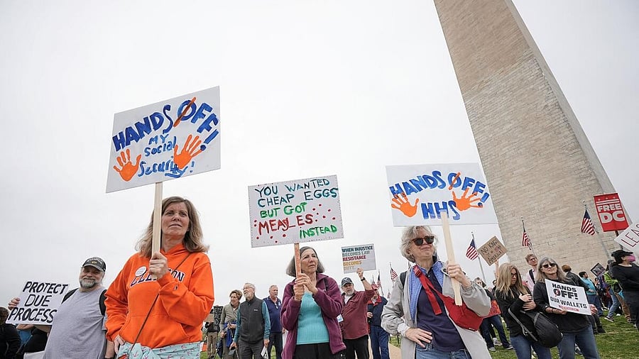 <div class="paragraphs"><p>Demonstrators rally against U.S. President Donald Trump and his adviser Elon Musk during a 'Hands Off!' protest on the Washington Monument grounds, in Washington.</p></div>