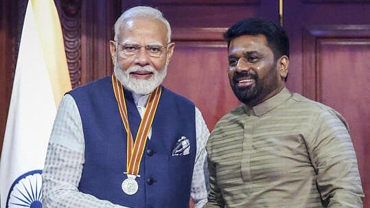 <div class="paragraphs"><p>Prime Minister Narendra Modi (L) being conferred with the 'Mithra Vibhushana' award by Sri Lankan President Anura Kumara Dissanayake during a ceremony at the presidential secretariat, in Colombo, Sri Lanka.</p></div>