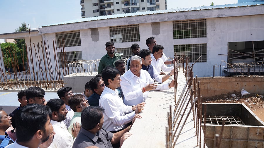 Minister of State for Railways V Somanna, along with Bengaluru South MLA Tejasvi Surya, inspects construction work at Padarayanapura and Hosahalli. 