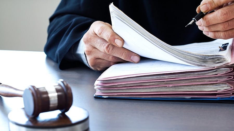 <div class="paragraphs"><p>Image showing a judge with a set of documents. For representational purposes.</p></div>