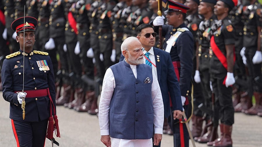 <div class="paragraphs"><p>Prime Minister Narendra Modi inspects an honour guard during his welcoming ceremony at Independence square in Colombo, Sri Lanka, April 5, 2025. </p></div>