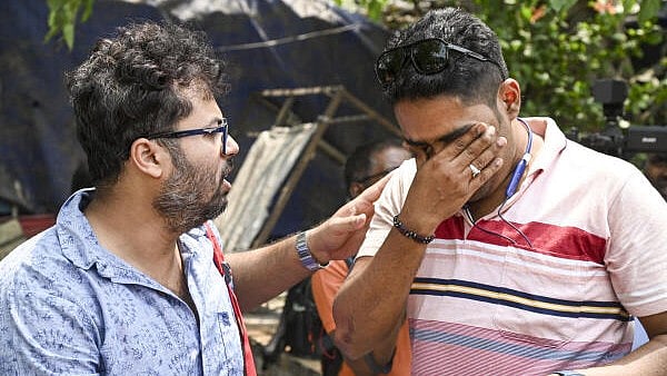 <div class="paragraphs"><p>Employees of West Bengal government schools react after the Supreme Court upheld the Calcutta High Court's verdict invalidating the appointment of 25,753 teachers and other staff in state-run and state-aided schools in West Bengal, in Kolkata.</p></div>