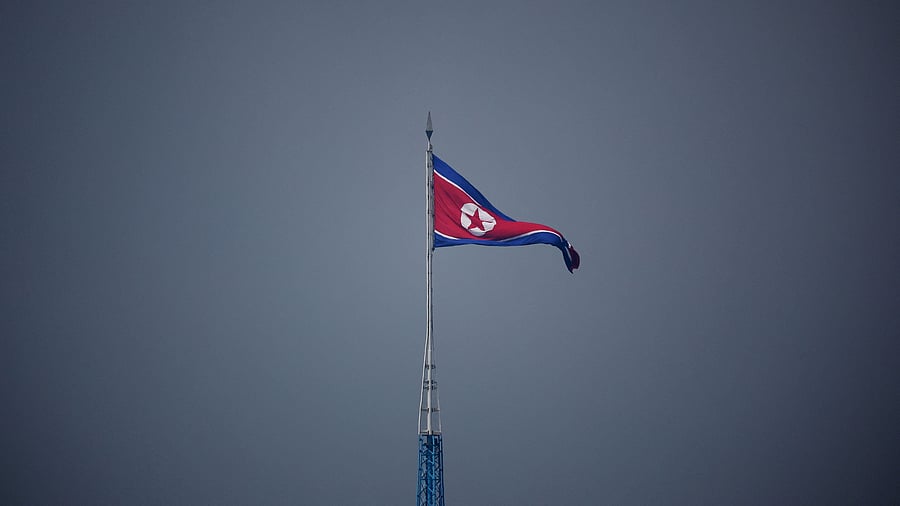 <div class="paragraphs"><p>A North Korean flag flutters.</p></div>