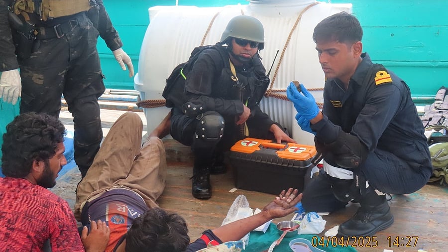 <div class="paragraphs"><p>Indian Naval officers administering aid to the injured Pakistani crew member.</p></div>