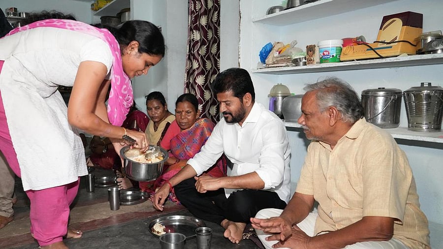 <div class="paragraphs"><p>Telangana CM Revanth Reddy having lunch with the rice scheme beneficiary, April 6, 2025.</p></div>