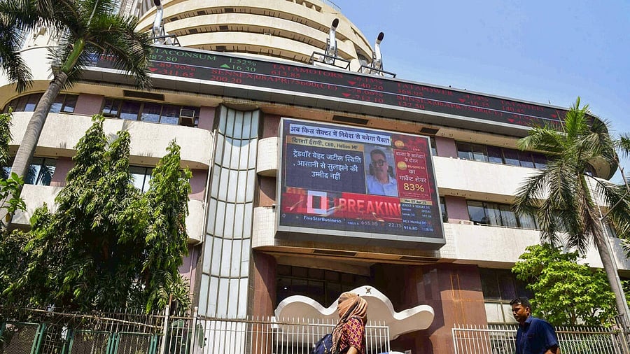 <div class="paragraphs"><p>People walk past the Bombay Stock Exchange (BSE) building, in Mumbai</p></div>