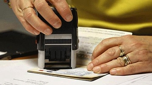 <div class="paragraphs"><p>Representative image of a visa being stamped.</p></div>