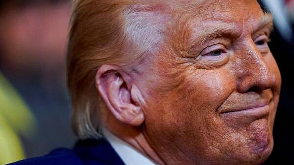 <div class="paragraphs"><p>US President Donald Trump smiles, on the day he signs energy-related executive orders, at the White House in Washington</p></div>