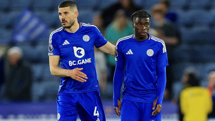 <div class="paragraphs"><p>Leicester City's Jeremy Monga (R) with Conor Coady (L).</p></div>