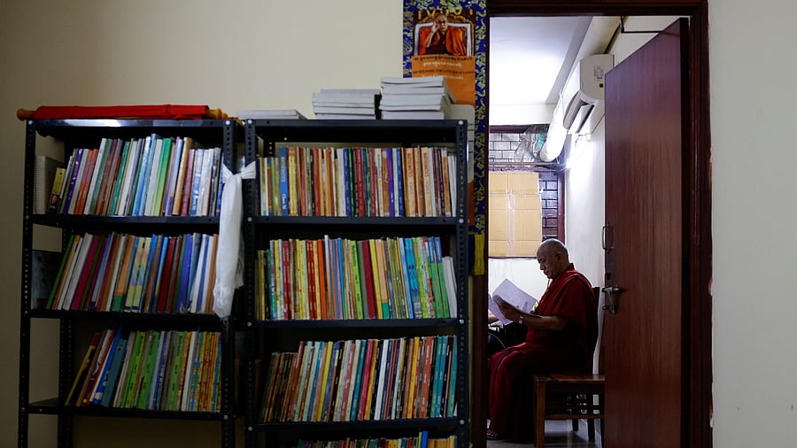 <div class="paragraphs"><p>Lama Chosphel Zotpa, a monk and vice president of Indian Himalayan Council of Nalanda Buddhist Tradition  reads a document at its office in New Delhi</p></div>