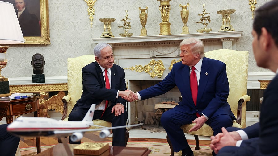<div class="paragraphs"><p>US President Donald Trump and Israeli Prime Minister Benjamin Netanyahu shake hands during a meeting in the Oval Office at the White House in Washington.</p></div>