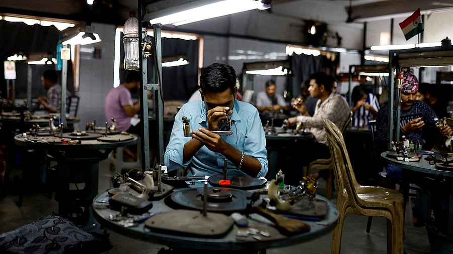<div class="paragraphs"><p>Craftsmen work on diamonds inside a diamond processing unit in Surat, India, April 3, 2025. </p></div>