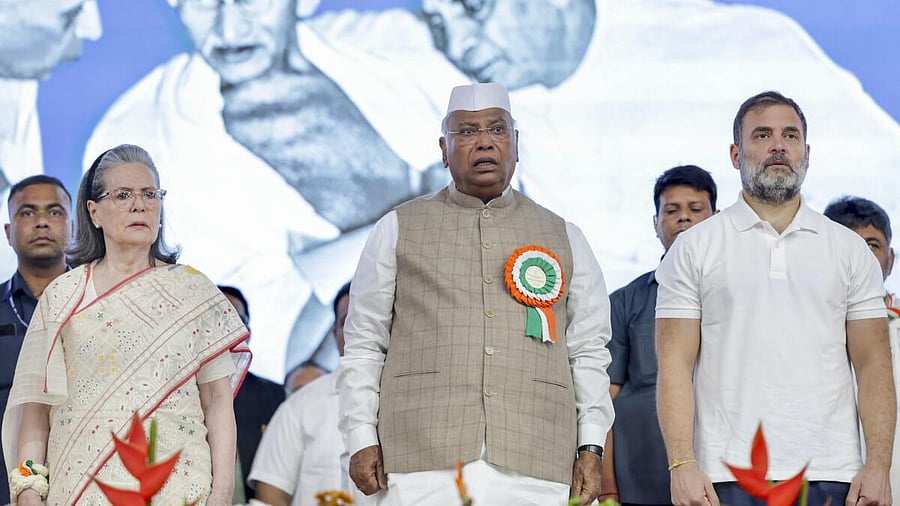 <div class="paragraphs"><p>Congress chief Mallikarjun Kharge (centre) flanked by senior leaders Sonia Gandhi (left) and Rahul Gandhi at the AICC session in Ahmedabad. </p></div>