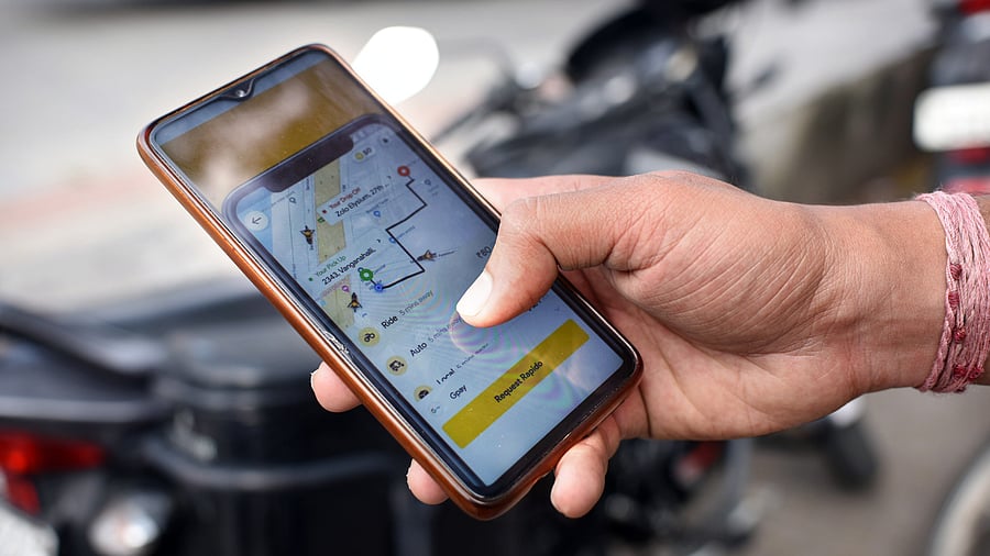 <div class="paragraphs"><p>For Point Blank story. Representational picture of a person booking two wheeler taxi on Rapido app, in Bengaluru on Thursday. </p></div>