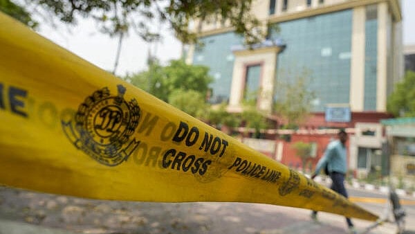 <div class="paragraphs"><p> 'Do Not Cross' police barricade tape fixed near the National Investigation Agency building, in New Delhi, Thursday, Apr. 10, 2025. Tahawwur Rana, a co-conspirator in the 26/11 Mumbai terror attacks, will land in India today, a day after a multi-agency Indian team left from the United States with him on a special flight on Wednesday.</p></div>