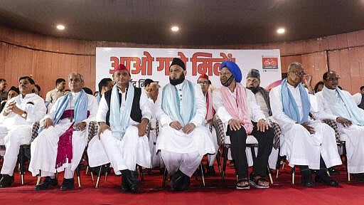 <div class="paragraphs"><p>Samajwadi Party chief Akhilesh Yadav with others during a ‘Holi-Eid Milan harmony ceremony’ organised at the party headquarters, in Lucknow.</p></div>